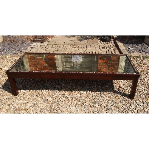 717 - AN EARLY/MID 20TH CENTURY CHINESE TEA TABLE
With central planished mirrored surface enclosed by a mo... 