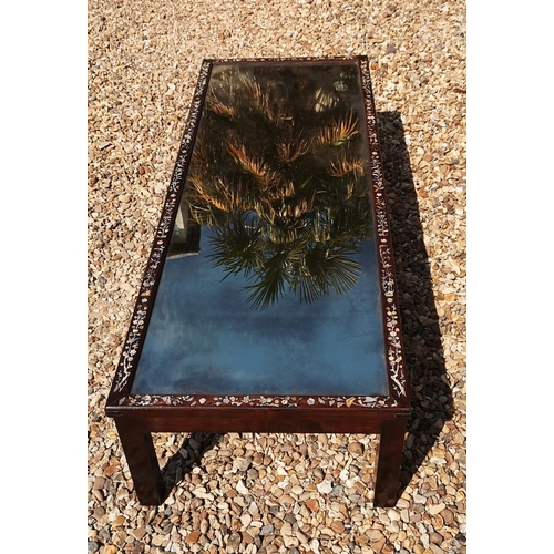 717 - AN EARLY/MID 20TH CENTURY CHINESE TEA TABLE
With central planished mirrored surface enclosed by a mo... 