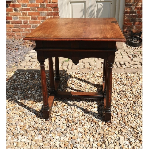 718 - LIBERTY & CO. LTD, LONDON, A MAHOGANY CENTRE TABLE
The square top above a shaped apron, raised on si... 