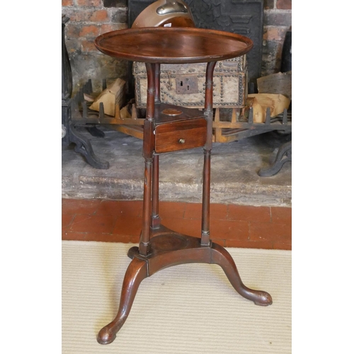 727 - A 19TH CENTURY MAHOGANY SHAVING STAND
The circular dish top above a single drawer, raised on three c... 