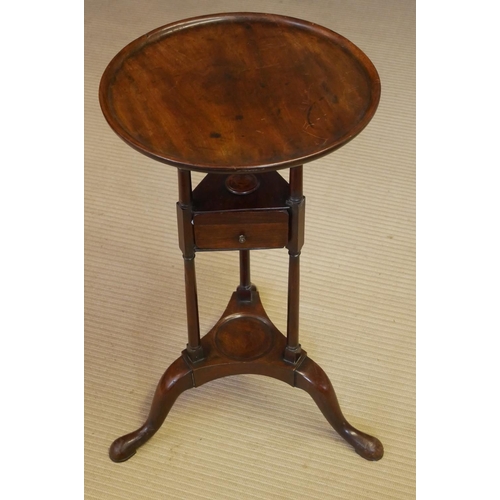 727 - A 19TH CENTURY MAHOGANY SHAVING STAND
The circular dish top above a single drawer, raised on three c... 