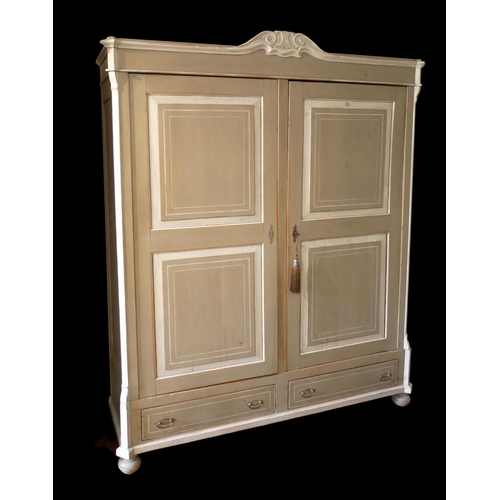 729 - A 19TH CENTURY DUTCH HANGING CUPBOARD
With two panelled doors above two drawers, in grey and cream p... 