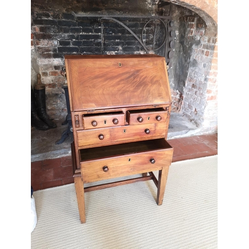 733 - A GEORGIAN AND LATER CHILDS MAHOGANY WRITING BUREAU
The fall front enclosing a fitted interior above... 