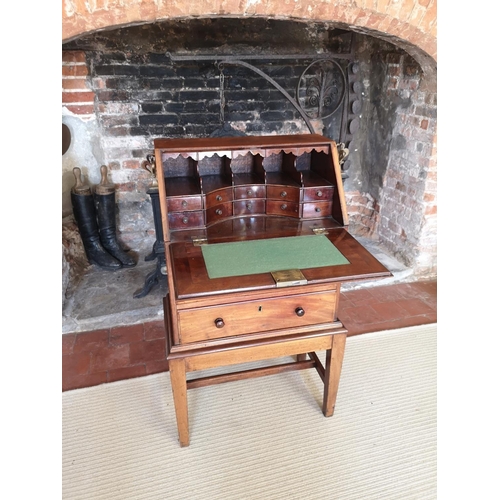 733 - A GEORGIAN AND LATER CHILDS MAHOGANY WRITING BUREAU
The fall front enclosing a fitted interior above... 