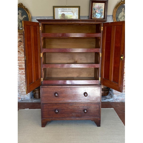 735 - A VICTORIAN MAHOGANY LINEN PRESS
The two panelled doors enclosing slides above two drawers, raised o... 