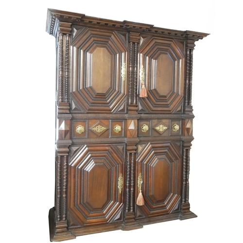 737 - AN IMPRESSIVE 17TH CENTURY DUTCH OAK CABINET
With dentil cornice above four ribbed panelled doors ce... 