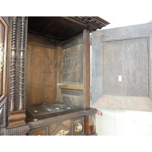 737 - AN IMPRESSIVE 17TH CENTURY DUTCH OAK CABINET
With dentil cornice above four ribbed panelled doors ce... 