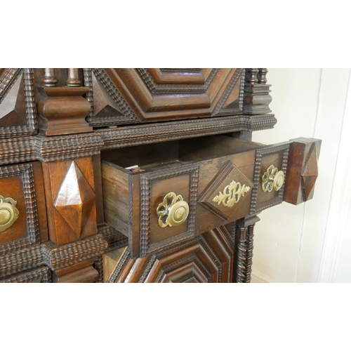 737 - AN IMPRESSIVE 17TH CENTURY DUTCH OAK CABINET
With dentil cornice above four ribbed panelled doors ce... 