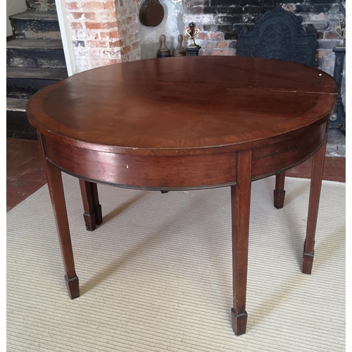 740 - A 19TH CENTURY MAHOGANY AND CROSSBANDED ‘D’ END DINING TABLE
With one extra leaf, raised on square t... 