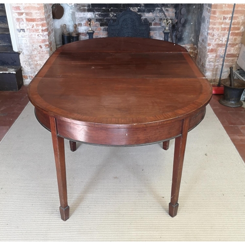 740 - A 19TH CENTURY MAHOGANY AND CROSSBANDED ‘D’ END DINING TABLE
With one extra leaf, raised on square t... 