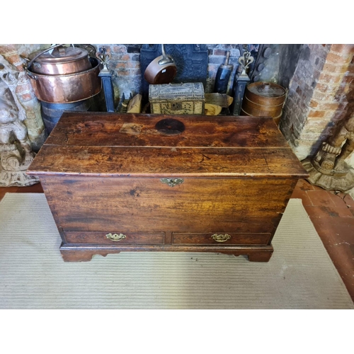 742 - AN 18TH CENTURY OAK MULE CHEST
The rise and fall top above two drawers, fitted with brass escutcheon... 