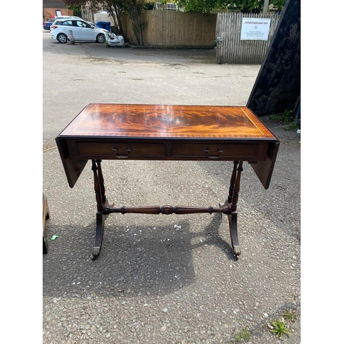 758 - A REGENCY STYLE MAHOGANY SIDE CABINET
The single drawer above a cupboard, along with a sofa table.
(... 