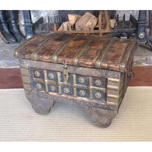 762 - AN INDIAN BRASS AND SHEESHAM WOOD DOMED TOPPED CHEST ON WHEELS.
(40cm x 53cm x 41cm)

Condition: goo... 