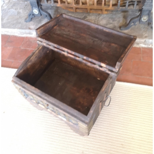 762 - AN INDIAN BRASS AND SHEESHAM WOOD DOMED TOPPED CHEST ON WHEELS.
(40cm x 53cm x 41cm)

Condition: goo... 