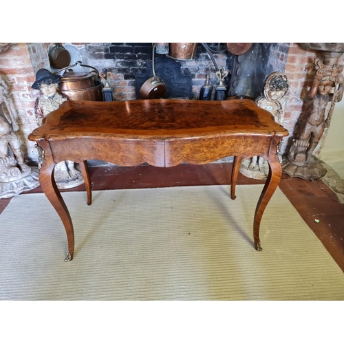 765 - A 19TH CENTURY FRENCH BURR AND FIGURED WALNUT MARQUETRY INLAID CENTRE TABLE
With ogee top above two ... 