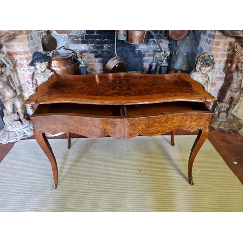 765 - A 19TH CENTURY FRENCH BURR AND FIGURED WALNUT MARQUETRY INLAID CENTRE TABLE
With ogee top above two ... 