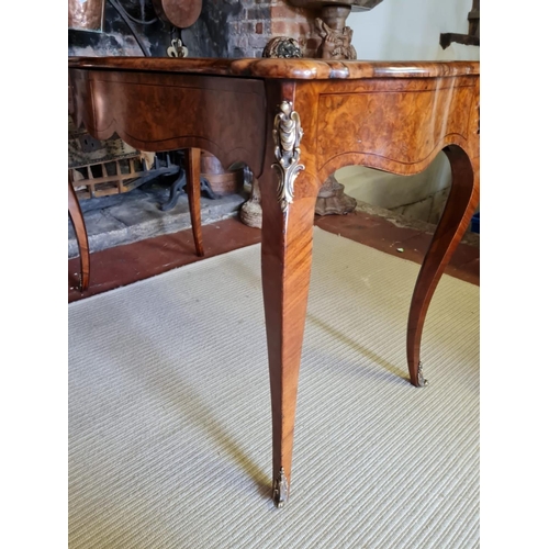 765 - A 19TH CENTURY FRENCH BURR AND FIGURED WALNUT MARQUETRY INLAID CENTRE TABLE
With ogee top above two ... 