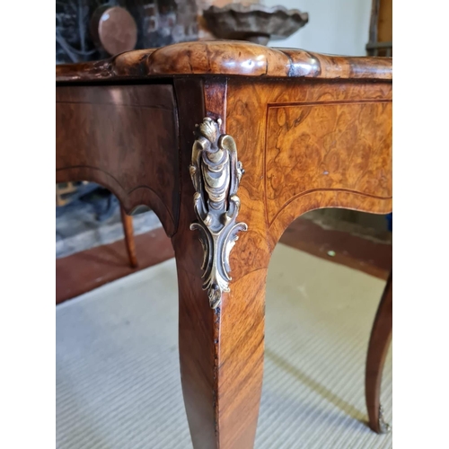 765 - A 19TH CENTURY FRENCH BURR AND FIGURED WALNUT MARQUETRY INLAID CENTRE TABLE
With ogee top above two ... 