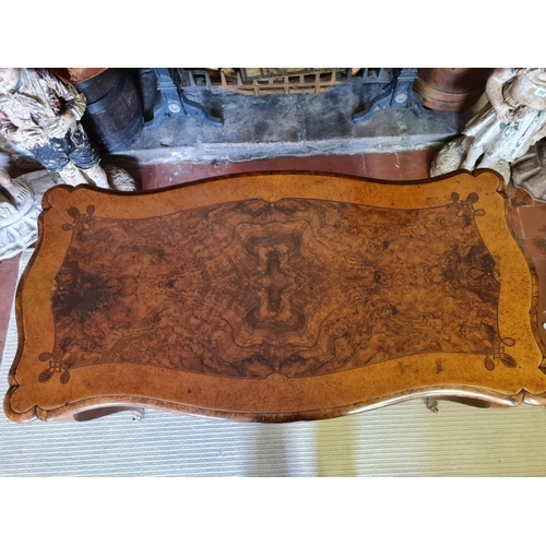 765 - A 19TH CENTURY FRENCH BURR AND FIGURED WALNUT MARQUETRY INLAID CENTRE TABLE
With ogee top above two ... 