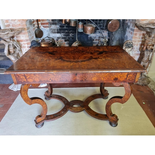 767 - AN 18TH CENTURY DUTCH WALNUT AND FLORAL MARQUETRY INLAID SIDE/WRITING TABLE
The rectangular top open... 