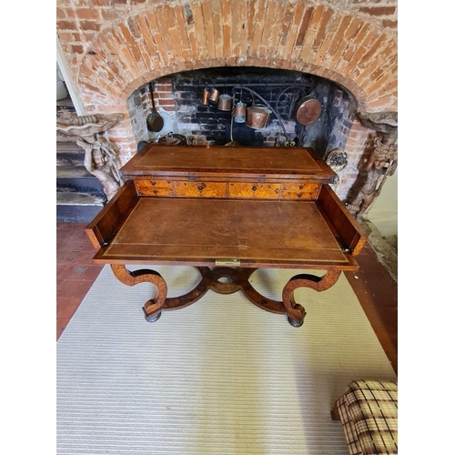 767 - AN 18TH CENTURY DUTCH WALNUT AND FLORAL MARQUETRY INLAID SIDE/WRITING TABLE
The rectangular top open... 