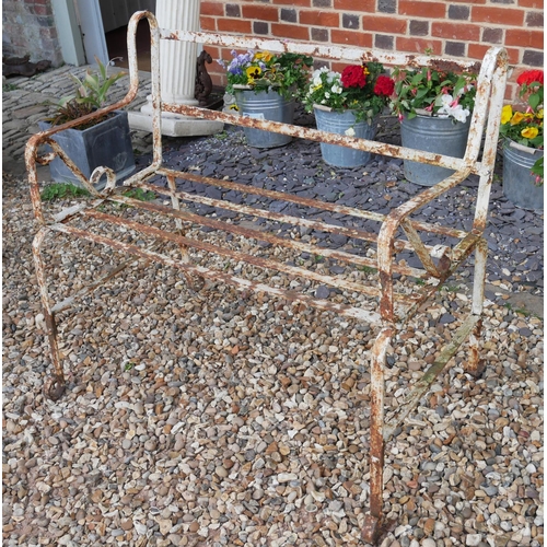 770 - A 19TH CENTURY WROUGHT IRON STRAPWORK GARDEN BENCH
Having scrolled arms and white painted finish. 
(... 