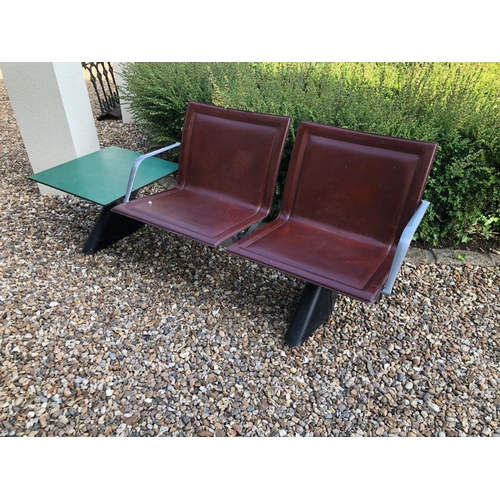 771 - AN ITALIAN  STEEL, ALUMINIUM AND LEATHER TWO SEATER BENCH
Brown leather covers with aluminium armres... 