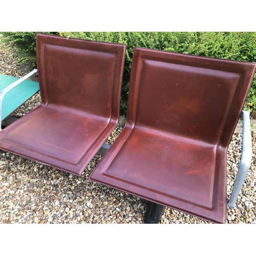 771 - AN ITALIAN  STEEL, ALUMINIUM AND LEATHER TWO SEATER BENCH
Brown leather covers with aluminium armres... 