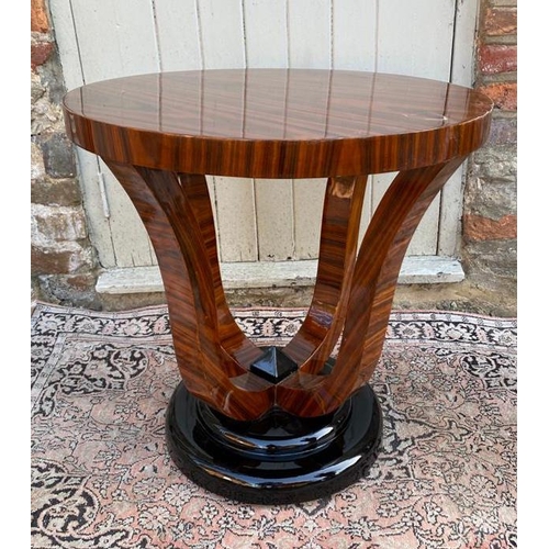 781 - A PAIR OF STYLISH ART DECO LACQUERED WALNUT CIRCULAR SIDE TABLES
With four swept supports standing, ... 