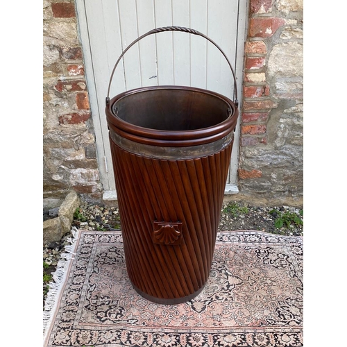 789 - A LARGE REGENCY DESIGN MAHOGANY PEAT BUCKET
With steel strap handle and liner contained in a taperin... 