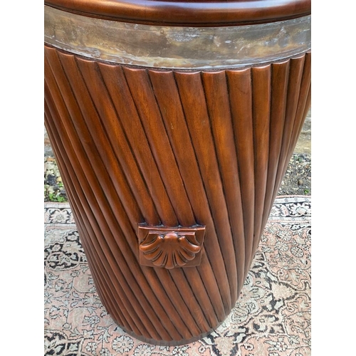 789 - A LARGE REGENCY DESIGN MAHOGANY PEAT BUCKET
With steel strap handle and liner contained in a taperin... 