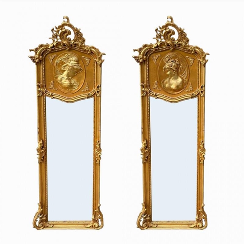 790 - A PAIR OF DECORATIVE GILT FRAMED PIER MIRRORS
With cartouches above female portraits and shaped beve... 