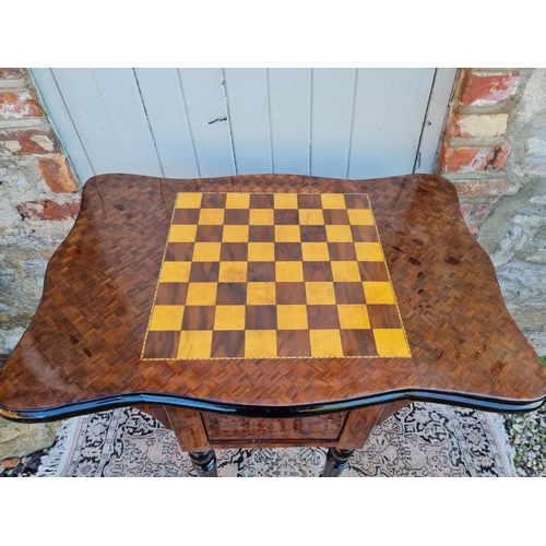 791 - A VICTORIAN STYLE MAHOGANY GAMES TABLE
With cartouche parquetry and checkerboard top above two drawe... 