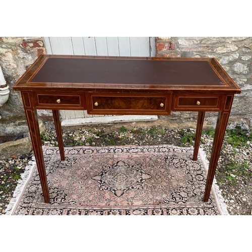 798 - A CONTINENTAL LACQUERED WALNUT AND MAHOGANY WRITING TABLE
With brown leather surface above three dra... 