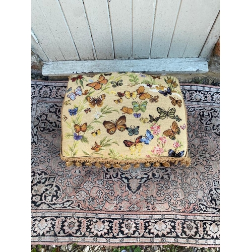 801 - A TAPESTRY UPHOLSTERED STOOL
Decorated with butterflies, on square tapering legs.
(46cm x 35cm x 29c... 