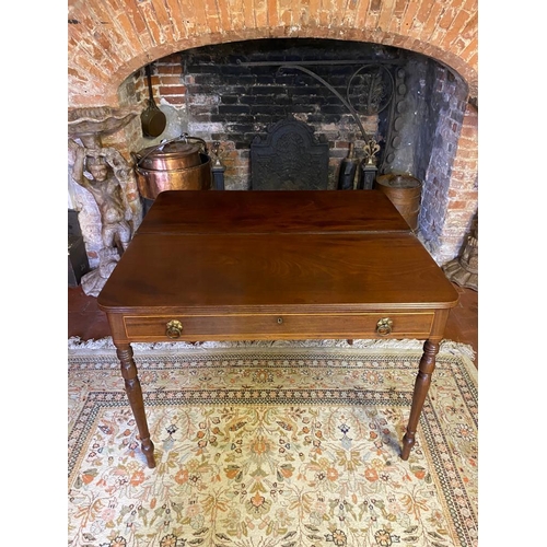 803 - A GEORGIAN MAHOGANY FOLD-OVER TEA TABLE
With a single drawer fitted with loop handles, raised on rin... 