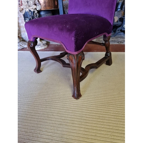 805 - AN 18TH CENTURY WALNUT STANDARD CHAIR
Upholstered in a purple fabric, raised on square cabriole legs... 