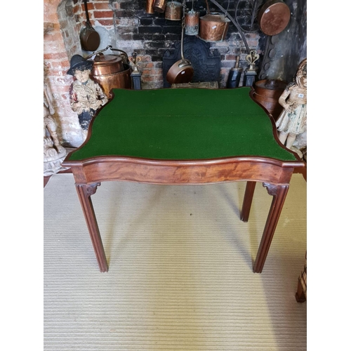 806 - A 18TH CENTURY MAHOGANY FOLD OVER CARD TABLE
Serpentine form with baize playing surface, on square c... 