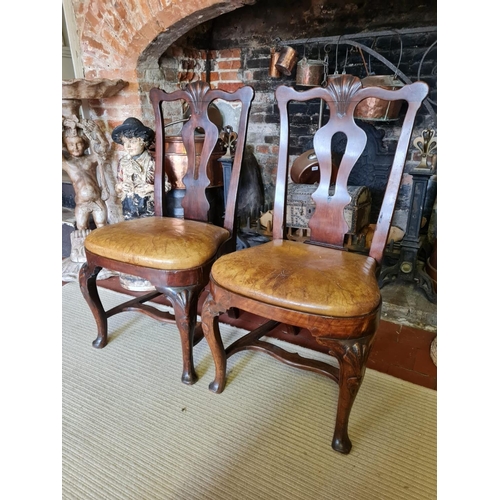 807 - A RARE PAIR OF EARLY/MID 18TH CENTURY IRISH WALNUT STRETCHER CHAIRS
With shaped rails centred with a... 