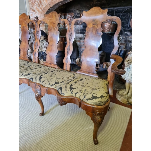 809 - AN 18TH CENTURY IRISH WALNUT CHAIR BACK THREE SEAT SETTEE
With carved and plain panelled back splats... 