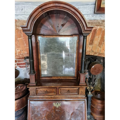 810 - AN EARLY 18TH CENTURY AND LATER OLIVE WOOD AND WALNUT BUREAU CABINET
Of narrow per portions, the dom... 