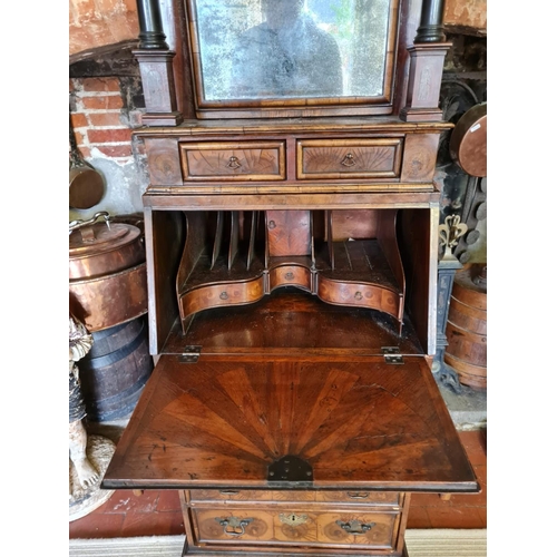 810 - AN EARLY 18TH CENTURY AND LATER OLIVE WOOD AND WALNUT BUREAU CABINET
Of narrow per portions, the dom... 