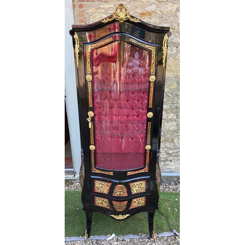 783 - A CONTINENTAL BOULLE AND EBONISED DISPLAY CABINET
Applied with gilt metal mounts, the single convex ... 