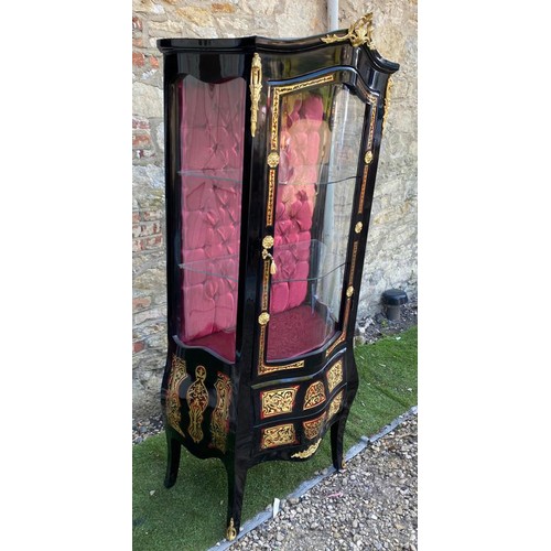 783 - A CONTINENTAL BOULLE AND EBONISED DISPLAY CABINET
Applied with gilt metal mounts, the single convex ... 