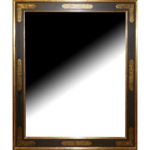 648 - A BEVELLED PLATE OVER MANTLE MIRROR
In a parcel gilt and brown frame.
(103cm x 123cm) 

Condition: g... 