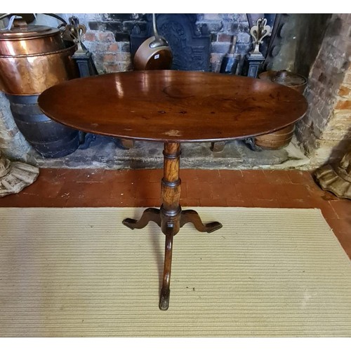 753 - A 19TH CENTURY MAHOGANY AND OAK OCCASIONAL TABLE
With oval tilt top raised on a single column with t... 