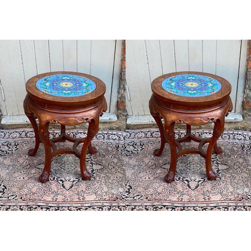 778 - A PAIR OF CHINESE HARDWOOD PLANT STANDS
The circular top inset with floral decorated cloisonné round... 