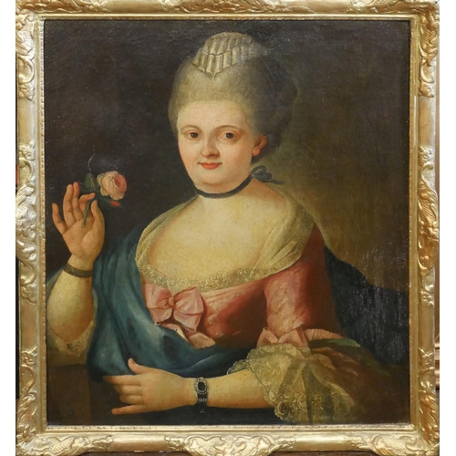 532 - AN 18TH CENTURY OIL ON CANVAS, PORTRAIT OF A LADY 
In a cerise pink silk dress holding a rose, gilt ... 