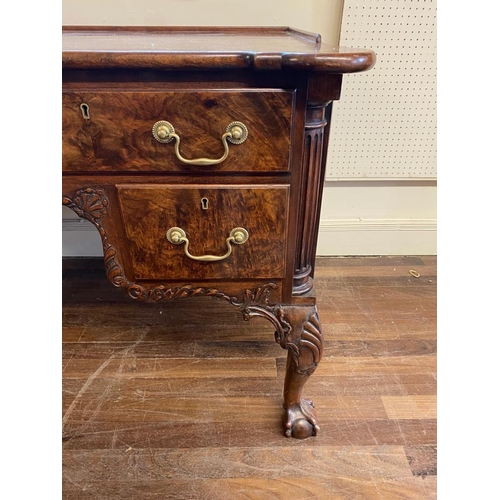 572 - A 19TH CENTURY GEORGE I STYLE WALNUT DESK
With galleried back, protruding rounded corners above and ... 