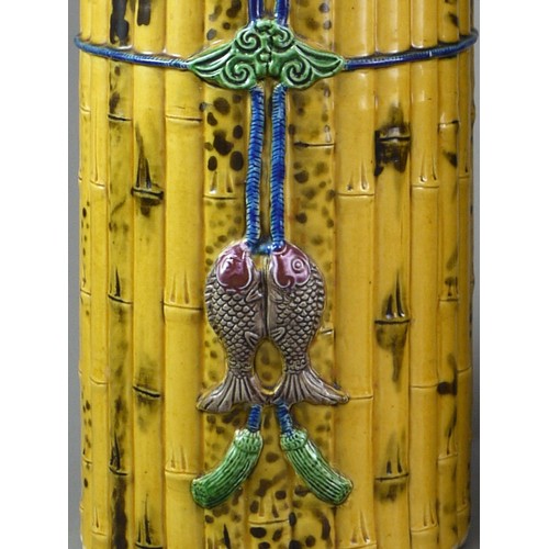 429 - A PAIR OF TALL CYLINDRICAL YELLOW BISCUIT ‘BAMBOO’ HAT STANDS, CIRCA 1900
Each carved and painted as... 